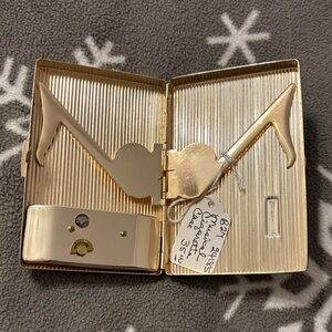 Vintage metal musical cigarette case in good vintage condition -E on case
